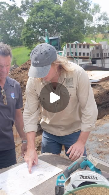 Nature team members reviewing plans during a residential pool build in an Instagram reel