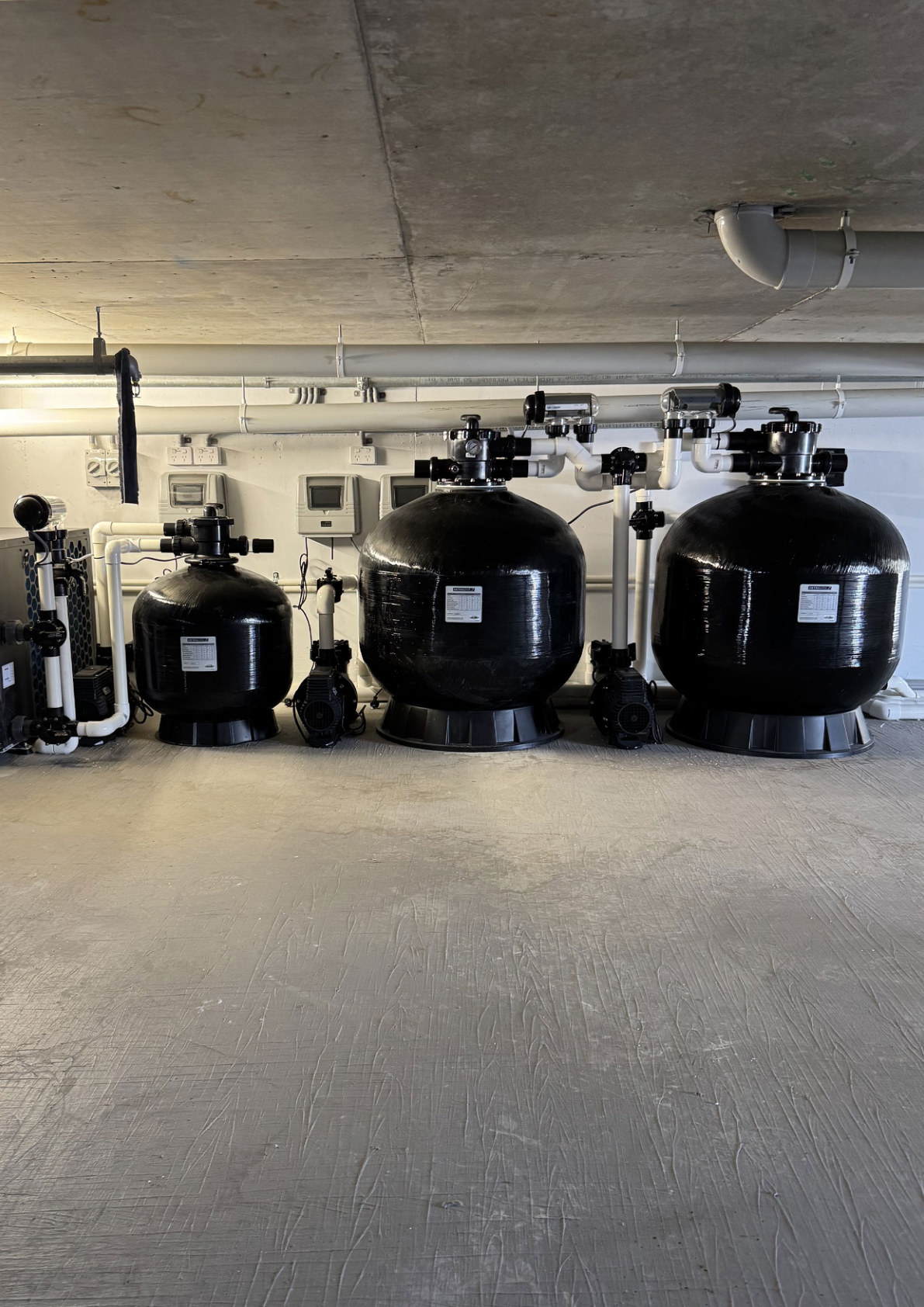 Pool plant room with filters, circulation pumps, valves and connected pipework